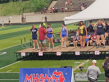 Layla Tahmouch receiving her 7th Place Discus award at the D2 State Finals.